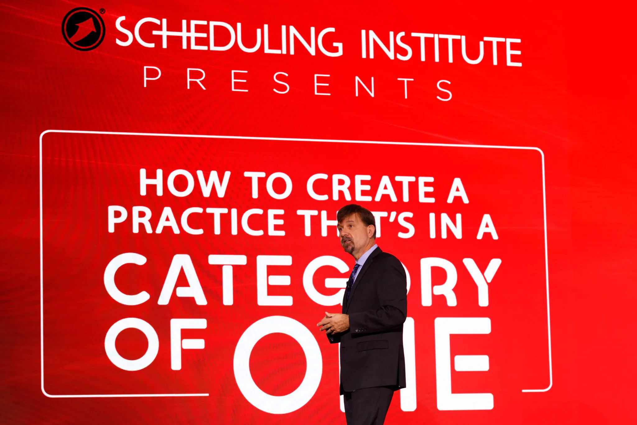 Joseph Michelli on stage delivering a keynote