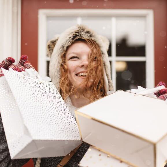 A Young Woman Out Shopping For Christmas Presents